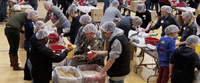 Food packing event in high school gym
